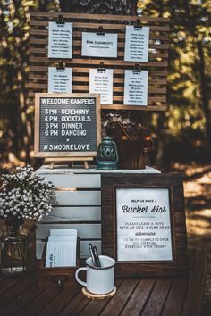 a sign that is sitting on top of a wooden table next to a cup and saucer