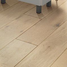 a white table sitting on top of a hard wood floor