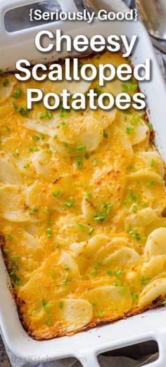 a casserole dish with potatoes and parsley on top, in a white baking dish