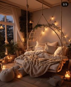 a bed with lights around it and pillows on the bottom, in front of a window