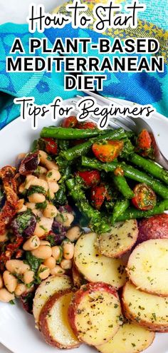 a white plate topped with potatoes, beans and green beans next to a blue towel