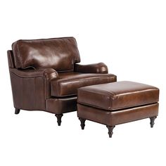 a brown leather chair and footstool sitting next to each other