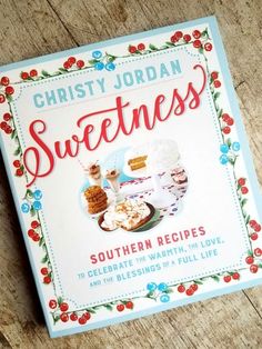 a cookbook sitting on top of a wooden table