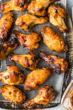 chicken wings on a baking sheet with sauce