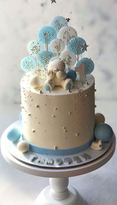 a blue and white cake with stars on top