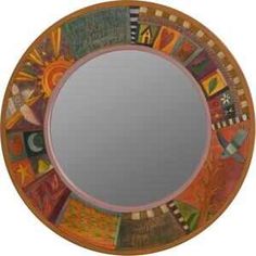 a round mirror with many different designs on it