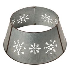 a large metal pot with snowflakes on it