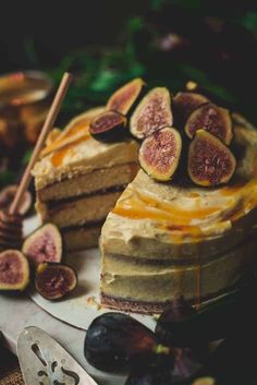 a slice of cake with figs and honey on top