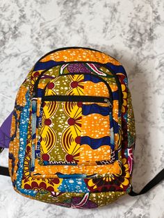 With bold colors and patterns these book bags will be the talk of the town. -Each bag has four pockets to hold all supplies needed for the day. -Adjustable straps-17 inches tall Need something a little smaller, check out our Small Ankara Book Bags. Multicolor Everyday Backpack With Adjustable Straps, Multicolor Backpack With Adjustable Straps For Everyday Use, Multicolor Rectangular Backpack For Trip, Multicolor Daily Backpack With Zipper Pocket, Daily Use Multicolor Backpack With Zipper Pocket, Multicolor Backpack With Zipper Pocket For Everyday Use, Multicolor Laptop Bag For Trips, Yellow Shoulder Bag For Back To School Travel, Multicolor Rectangular Backpack With Zipper Pocket