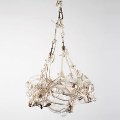 a white chandelier hanging from a ceiling