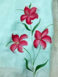 three red flowers on a blue background