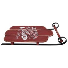 a wooden sled with an iron handle on the front and sides, decorated with words