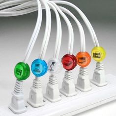 an assortment of colorful lights connected to wires