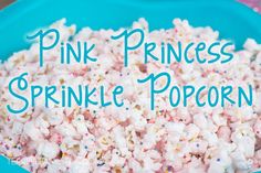 pink princess sprinkle popcorn on a blue plate with the words, pink princess sprinkle popcorn