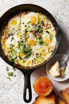 an iron skillet filled with eggs and bread