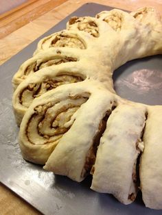 a pastry is sitting on top of a cutting board and ready to be cut into pieces