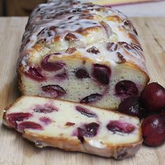 a loaf of bread with cherries on it