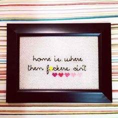 a cross - stitch picture with the words home is where them poken'out