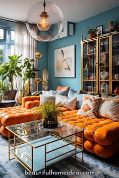 a living room with orange couches and blue walls