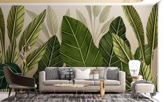 the living room is decorated with tropical leaves