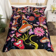 an image of a bed with colorful flowers and plants on the comforter cover set