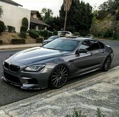 a silver car parked on the side of a road