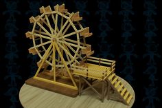 a wooden model of a ferris wheel and bench