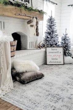 a living room decorated for christmas with white walls and fireplace, fur rugs on the floor