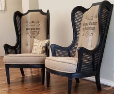 two chairs sitting on top of a hard wood floor