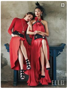 two women in red dresses sitting next to each other