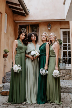 the bridesmaids are all dressed in green dresses