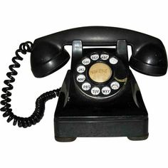 an old black phone with two hands on the receiver and one at the telephone cord