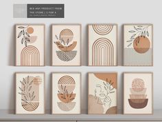 six framed art prints on a shelf in front of a wall with plants and geometric shapes