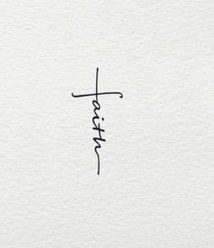 the word faith written in cursive writing on white paper with a black ink pen