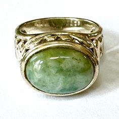 Sterling Jade Ring, High Setting, Oval Jade Stone, Ornate Sterling Filigree Sides, Size 8 Ring, Vintage Gemstone Jewelry Vintage sterling silver jade ring ring with ornate filigree design.  Large oval jade stone with ornate open work high setting with filigree sides. The ring is signed 925 SU Thailand.  Size 8   The top of the ring is 3/4"  x 1/2" x 3/8" high..    Wonderful vintage condition. More Jade https://www.etsy.com/shop/VintageVogueTreasure?ref=hdr&search_query=jade More rings https://www.etsy.com/your/shops/VintageVogueTreasure/tools/listings/query:ring,order:ascending Jade Ring, Saint James, Filigree Design, Jade Stone, Classic Ring, Ring Vintage, Jewelry Vintage, Ring Ring, Cute Earrings