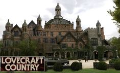 a large building with a sign in front of it that says lovecraft country on the side