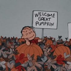 a sign that says welcome to the pumpkin patch with a cartoon character holding it up