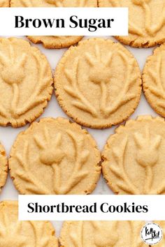 peanut butter cookies are arranged in rows on a white surface with the word love spelled out