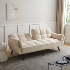 a living room with a couch and coffee table