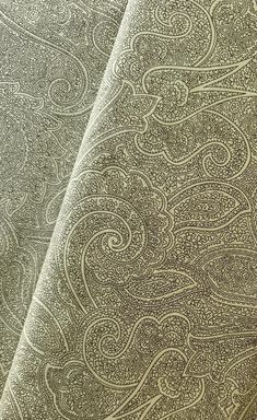 an image of a close up view of a paisley pattern on a fabric material background