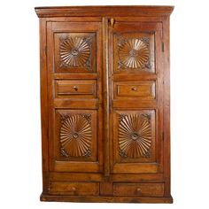 an old wooden armoire with carvings on it