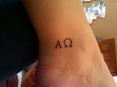 a person with a tattoo on their foot that has the letters a and q in it