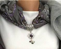 Silver Blossom If you find yourself debating whether you should wear a beautiful necklace or a feminine statement scarf, this is the perfect solution for you! A silk scarf necklace in the shades of gray and purple with brown undertones, decorated with a pendant of gray pearls. The jewel hangs on an Art Nouveau style silver piece, and the flower beneath it is handmade with natural gray pearls. The center of the flower is made of a purple Charoite stone, and the petals are made of Nacre (mother of pearls).   Timeless, feminine and adds grace and luxury to any look. A multi-purpose gift for a woman you love. The pieces can be worn separately. scarf  - 42"X40" jewelry length- 2.8" Arrives in a pretty gift wrap. If you want something special made just for you, please,  contact me. Thank you for Pearl Jewelery, Statement Scarf, Scarf Necklace, Art Nouveau Style, Shades Of Gray, The Jewel, Mother Pearl, Pretty Gift, Scarf Jewelry