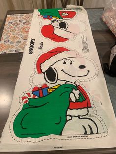 a snoopy christmas table runner on a dining room table