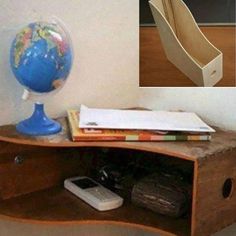 a desk with a globe and books on it next to a wooden shelf that has an open bookcase