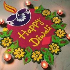 a colorful happy diwal with candles on the floor