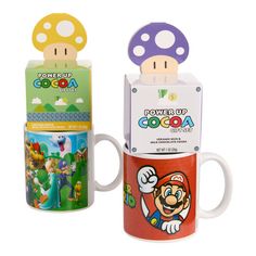 two coffee mugs with mario and luigi on them, one has a mushroom on top