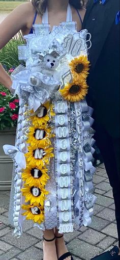 a man and woman standing next to each other wearing sunflowers on their wedding day