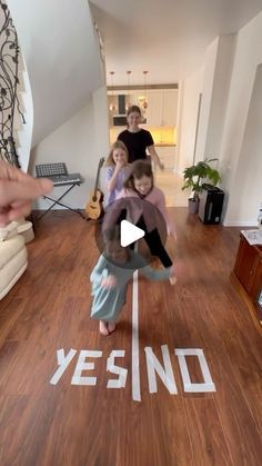 a group of people standing on top of a wooden floor