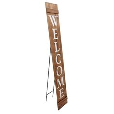 a wooden welcome sign with the word welcome written on it's front and side